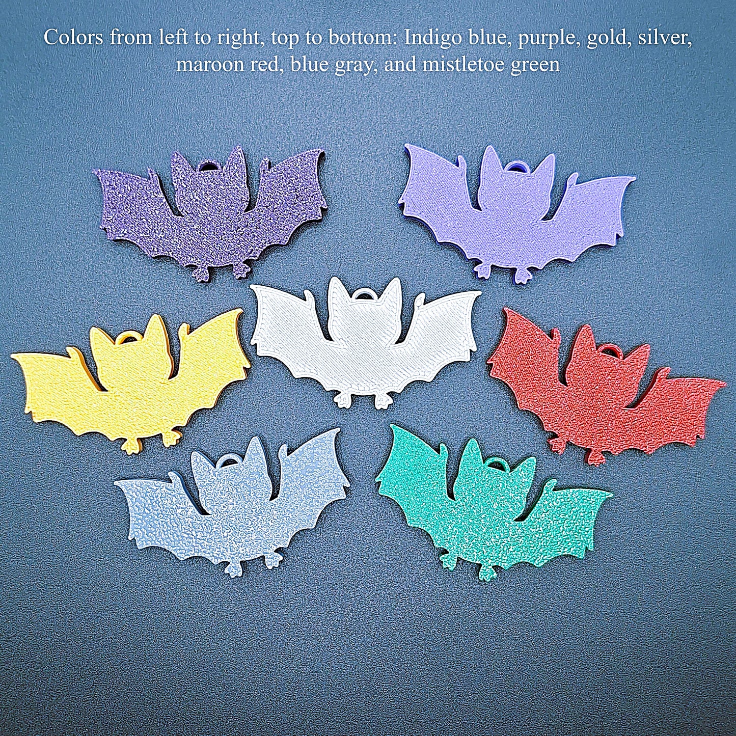 Photo guide of multicolor bat keychains, sustainable Halloween key rings, gothic party favors, and quirky bat-themed accessories.