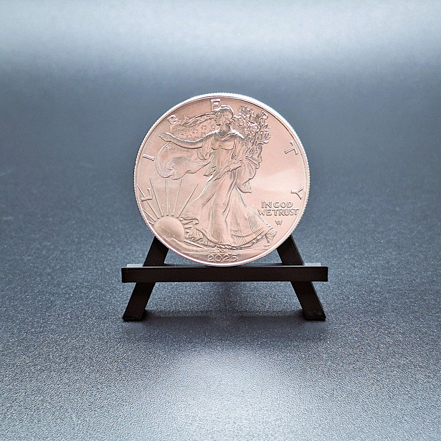 Mini foldable easel holding an American Silver Eagle – compact display stands perfect for showcasing collectible cards, ideal for vendors, collectors, and organized card displays.