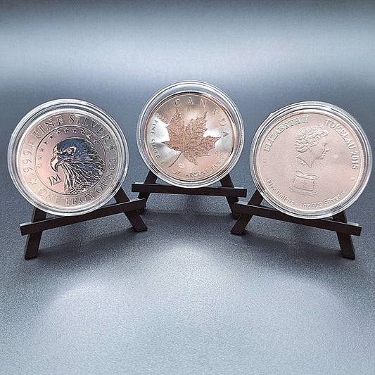 Mini foldable easels holding coins – compact and portable display stands, perfect for showcasing coins, trading cards, art, photos, or products at craft fairs, markets, and retail displays.