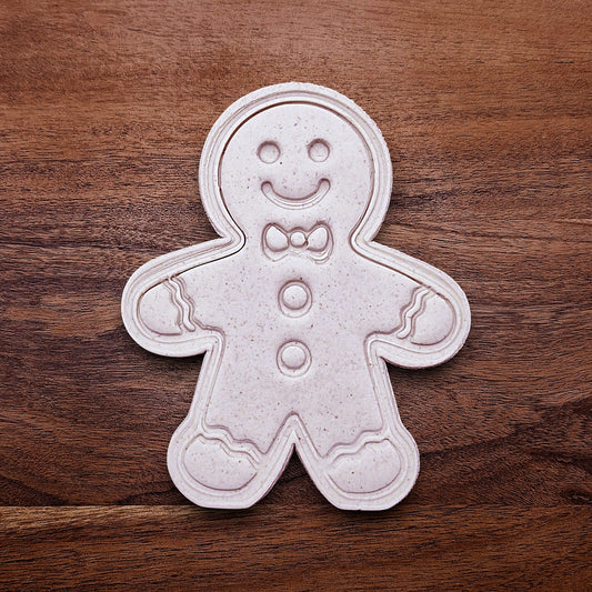 Holiday dough cutout with stamped gingerbread man design—ideal for Christmas cookies, fondant decorating, and festive baking with no piping needed.