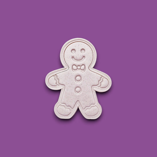 Holiday dough cutout with stamped gingerbread man design, ideal for Christmas cookies, fondant decorating, and festive baking with no piping needed.