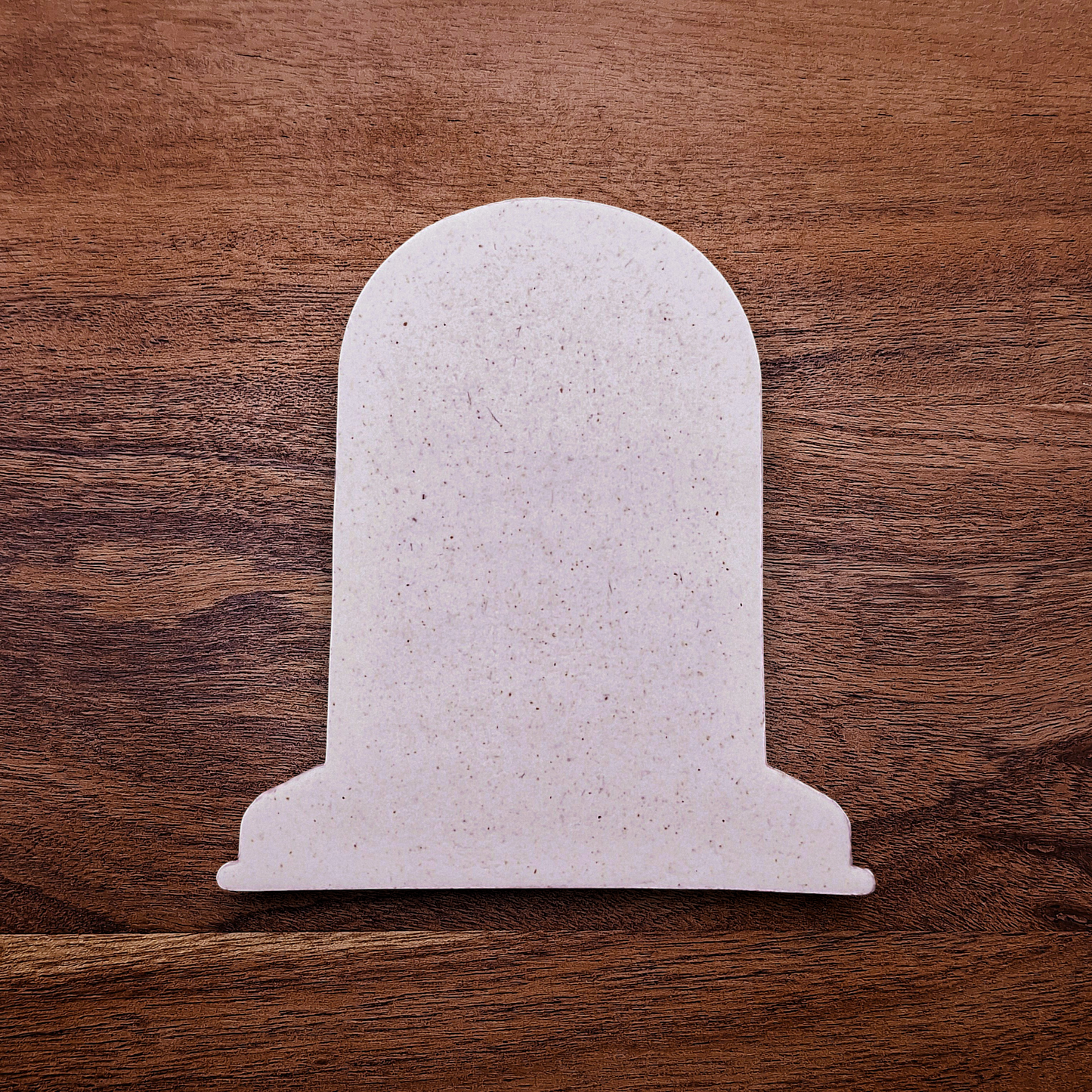 Gravestone cookie cutter cutout for Halloween cookies, fondant, and crafts, ideal for spooky baking projects and party favors.