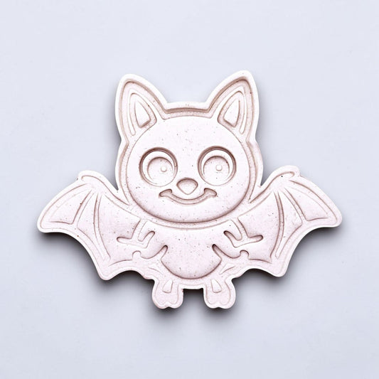 Close-up of bat cookie cutter dough imprint, perfect for spooky Halloween cookies, fondant crafts, and gothic-themed baking projects.