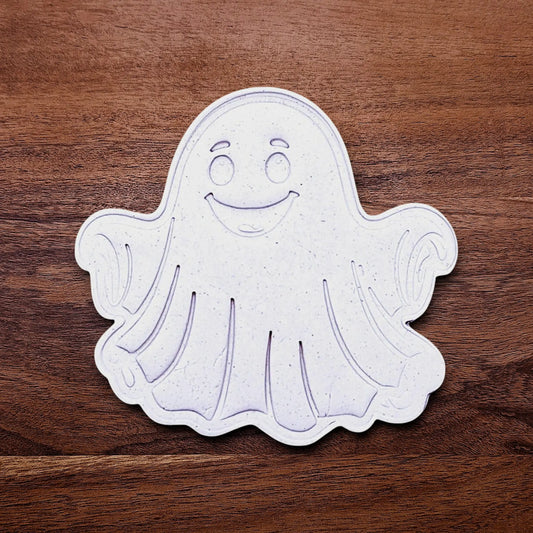 Handmade and customizable ghost cookie cutter dough cutout and imprint, great for baking Halloween trick or treats or kid-friendly spooky snacks.