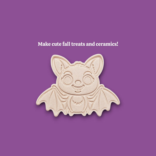 Stamped cute bat cookie dough with cute details from cutter and stamp setโperfect for cute and spooky Halloween bakes without the need for piping.