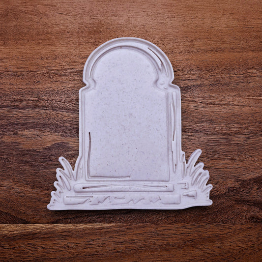Gravestone cookie cutter dough cutout with imprint, ideal for Halloween cookies, fondant toppers, and spooky DIY baking projects.