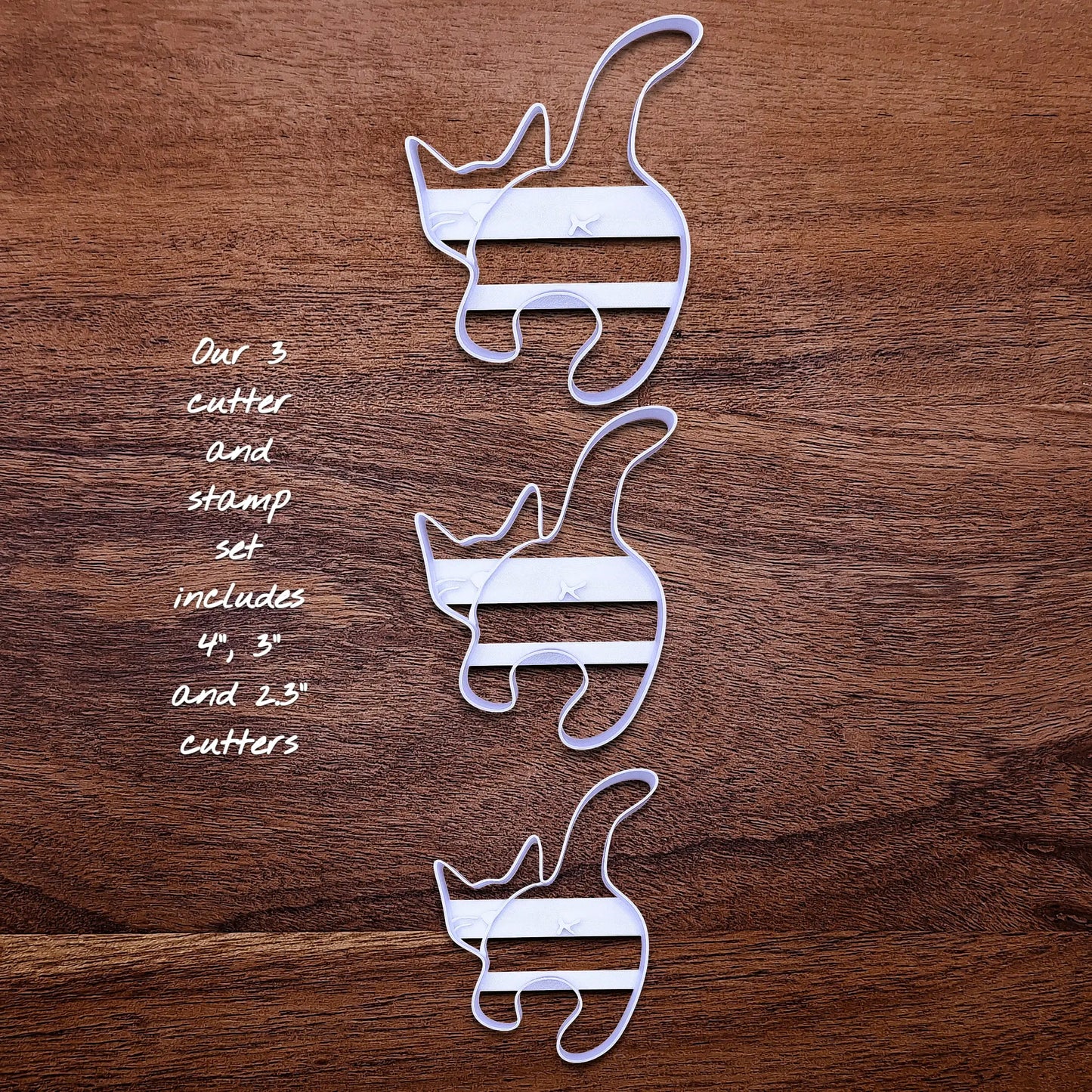 Front of three handmade and customizable cat butt cookie cutter baking molds, perfect for gifting, gag gifts, white elephant gifting, and cat themed parties and treats.