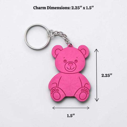 Colorful teddy bear keychain in magenta - handmade eco-friendly charms perfect for kids, baby showers, party favors, or animal-themed gifts.