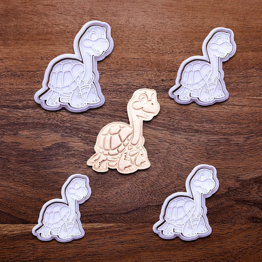 Handmade and customizable turtle cookie cutters and stamps alongside a dough imprint, ideal for ocean-themed baking, birthday party treats, or handmade gift ideas.