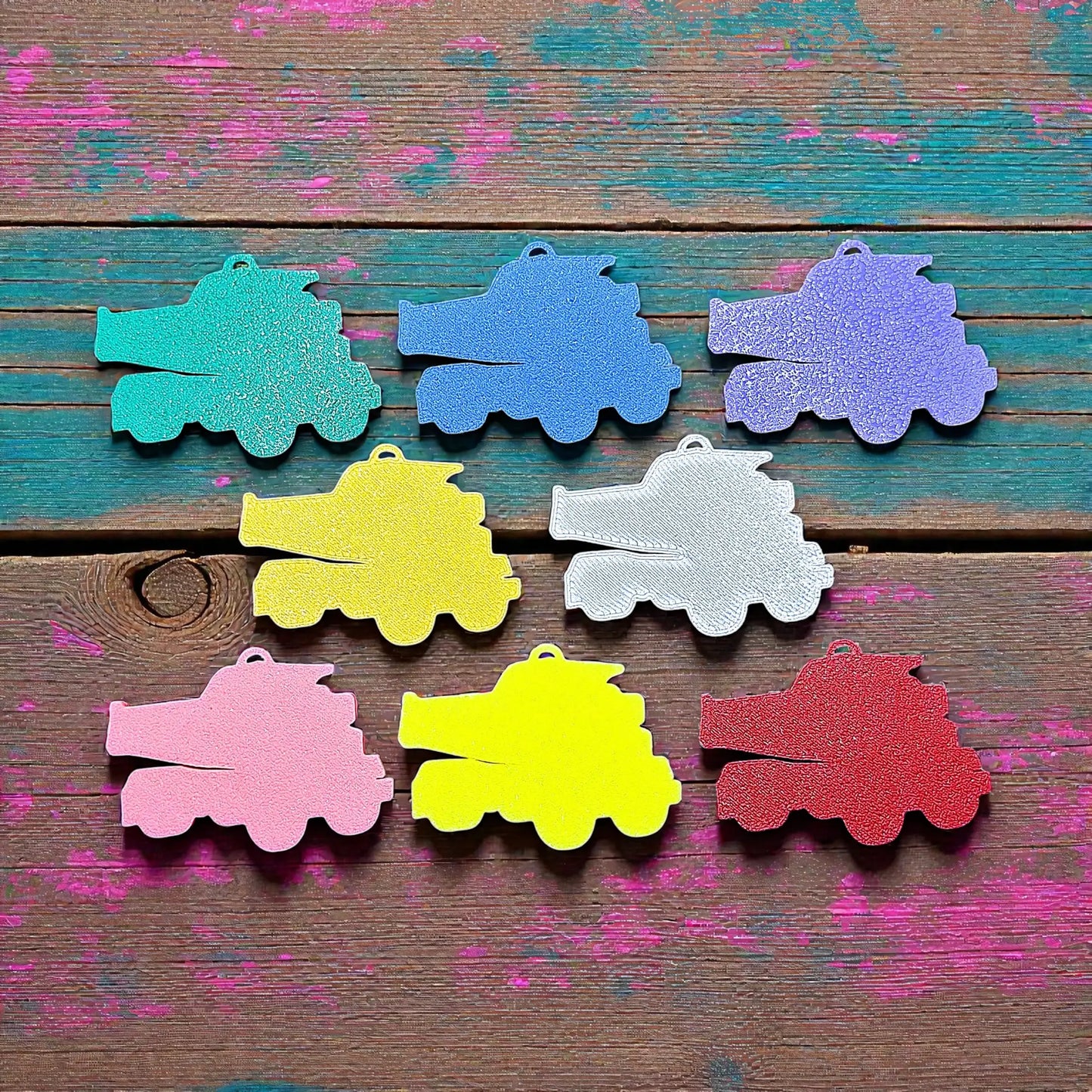 Reverse of handmade and customizable dump truck keychains in assorted colors, perfect for classroom prizes, party favors for kids birthdays, baby showers and unique backpack charms.