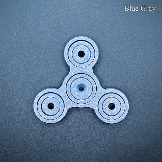 Sleek blue gray 3" pronged fidget spinner for desk, classroom, or travel use. Smooth, silent spin for focus and stress relief. Eco-friendly and handmade.