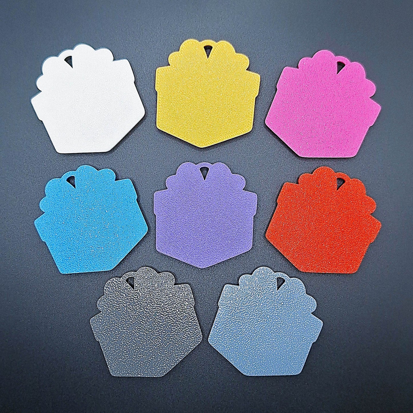 Back view of 8 colorful gift box keychains—handmade, sustainable accessories ideal for birthday bags, festive crafts, or party giveaways.