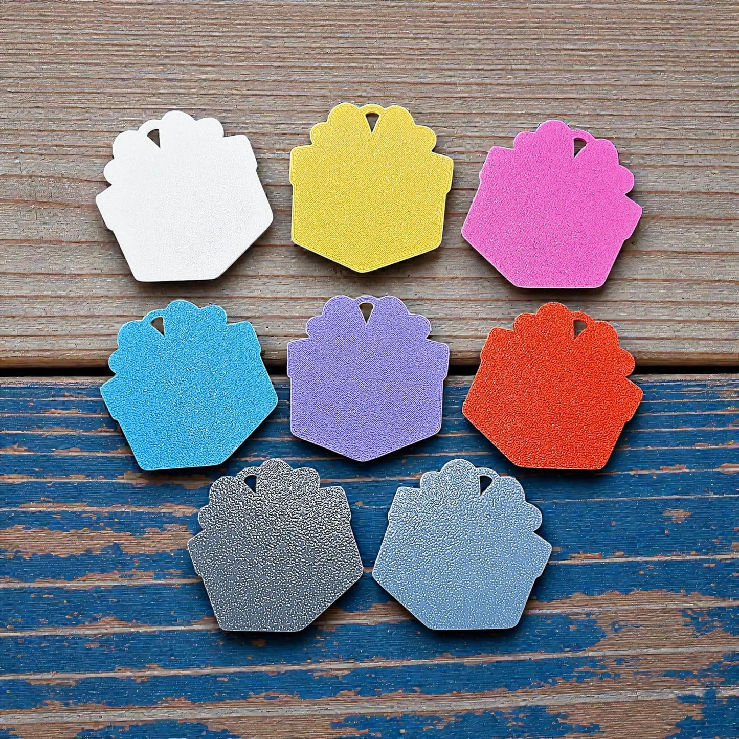 Reverse of handmade and customizable gift box keychains in assorted colors—fun, eco-conscious present charms perfect for gifting or Christmas party favors.