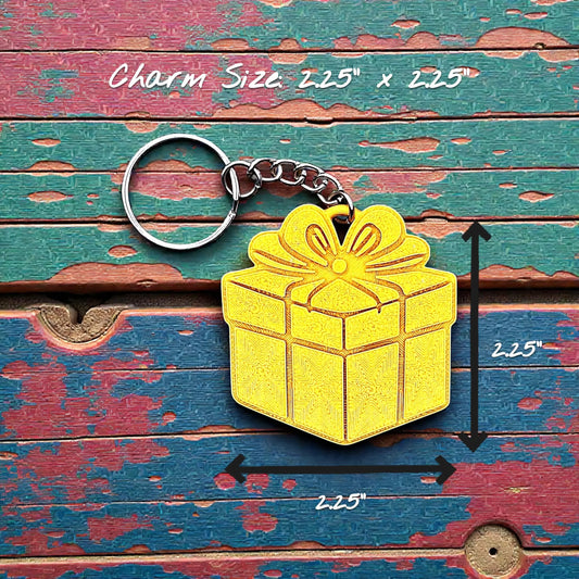 Handmade and customizable gift box keychain in gold - fun, eco-conscious present charms perfect for gifting or Christmas party favors.