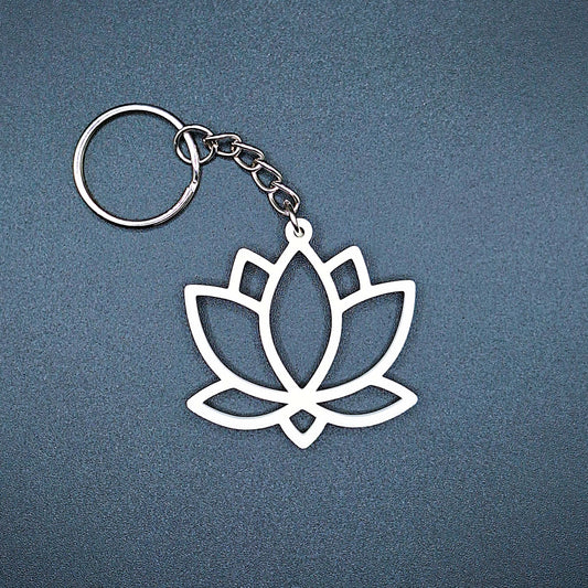 White lotus flower keychain with minimalist design, symbolizing purity and new beginnings, crafted for spiritual gifting or daily peace.