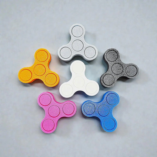 Handmade and customizable mini fidget spinners in various colors and ideal for quiet, stress-relieving play, anxiety relief and focus.