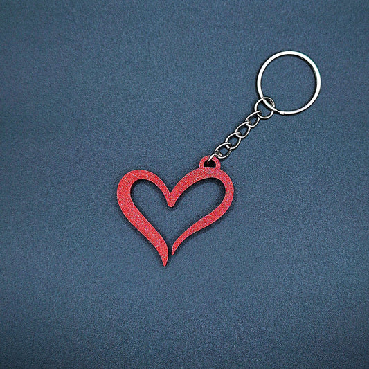 Maroon red heart keychain with smooth modern shape, a handmade and eco-friendly charm for romantic gifting or keychain personalization.