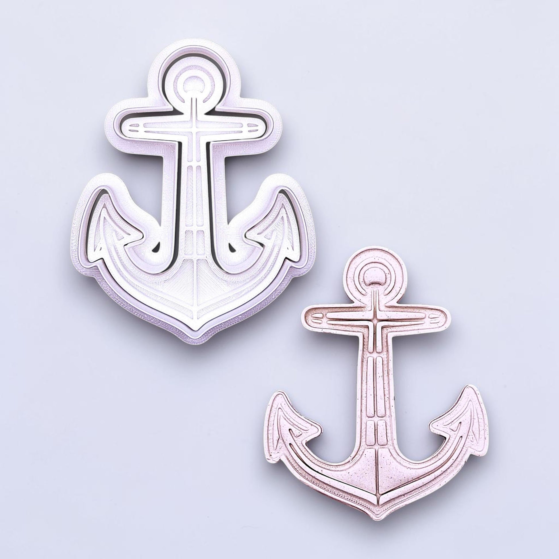 Anchor cookie cutter with matching stamp and dough cutout. Ideal for making detailed cookies, fondant toppers, or ocean party treats.