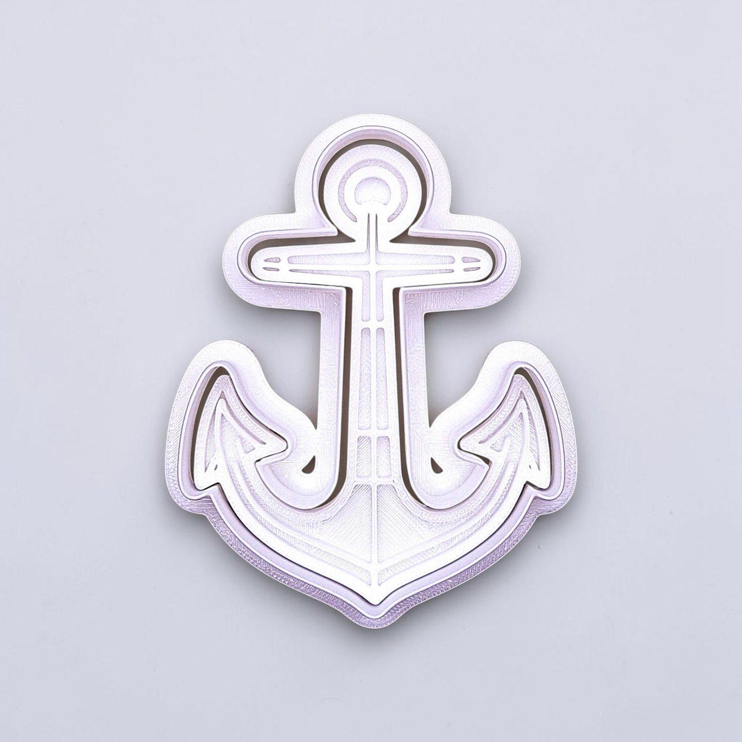 Anchor cookie cutter with matching stamp. Ideal for making detailed cookies, fondant toppers, or ocean party treats.
