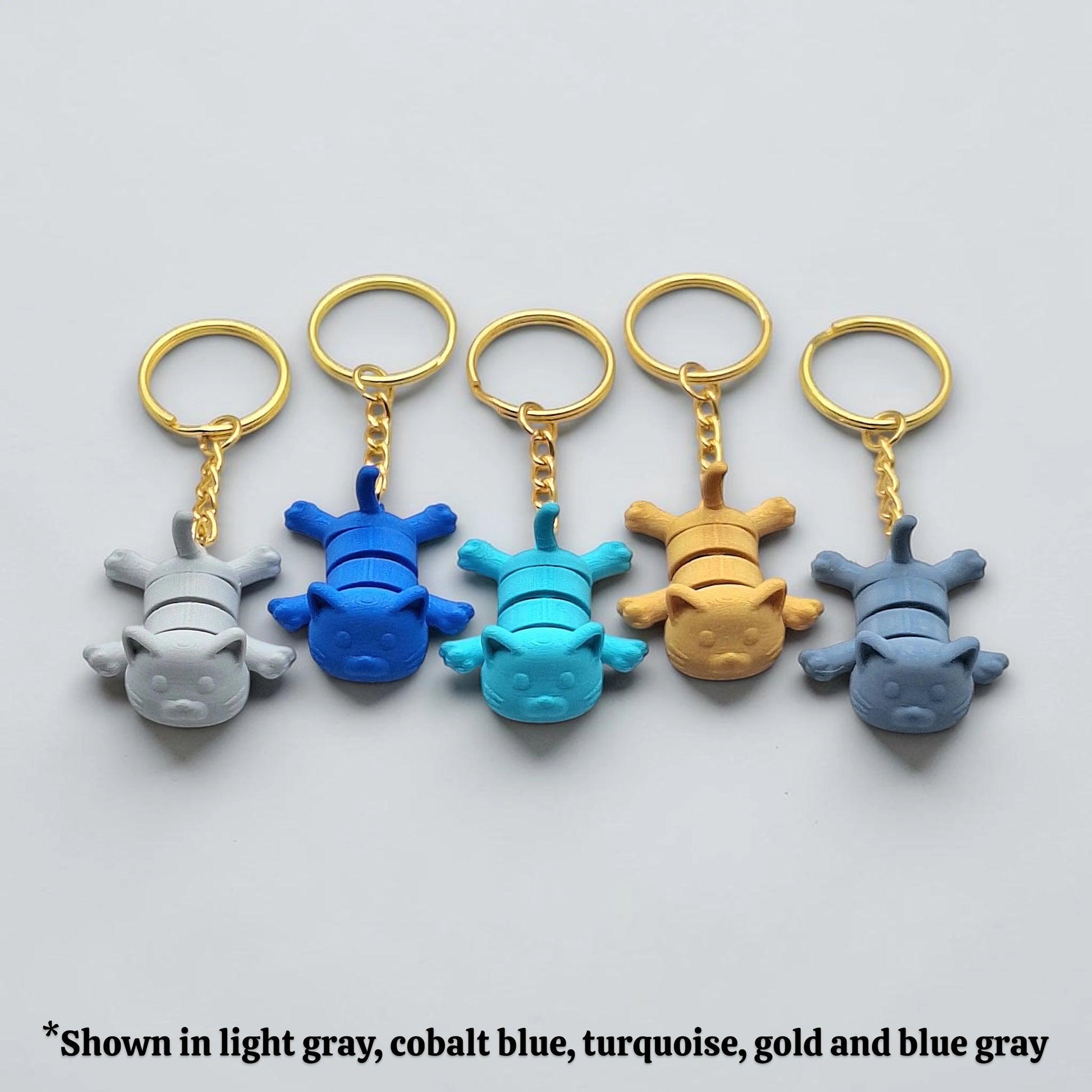 Cat keychains in multiple colors, customizable and handmade, perfect for classroom prizes, party favors and event giveaways.
