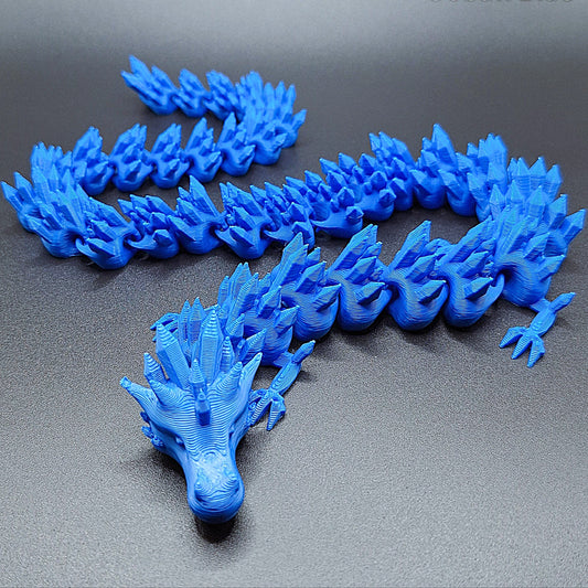 Cobalt blue articulated dragon fidget toy with segmented poseable body, handmade in eco-friendly PLA