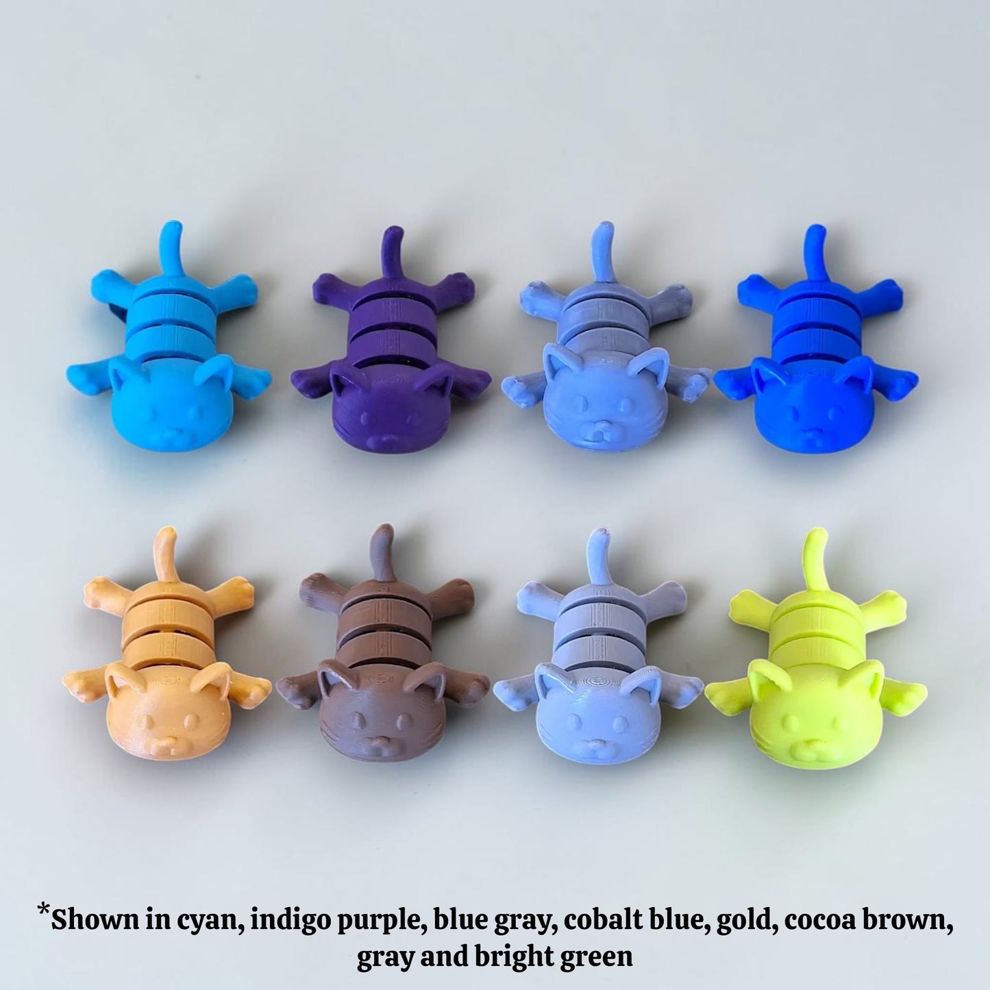 Handmade and customizable articulated cat keychains in unique colors, great for keys, backpacks, and small gifts with charm.