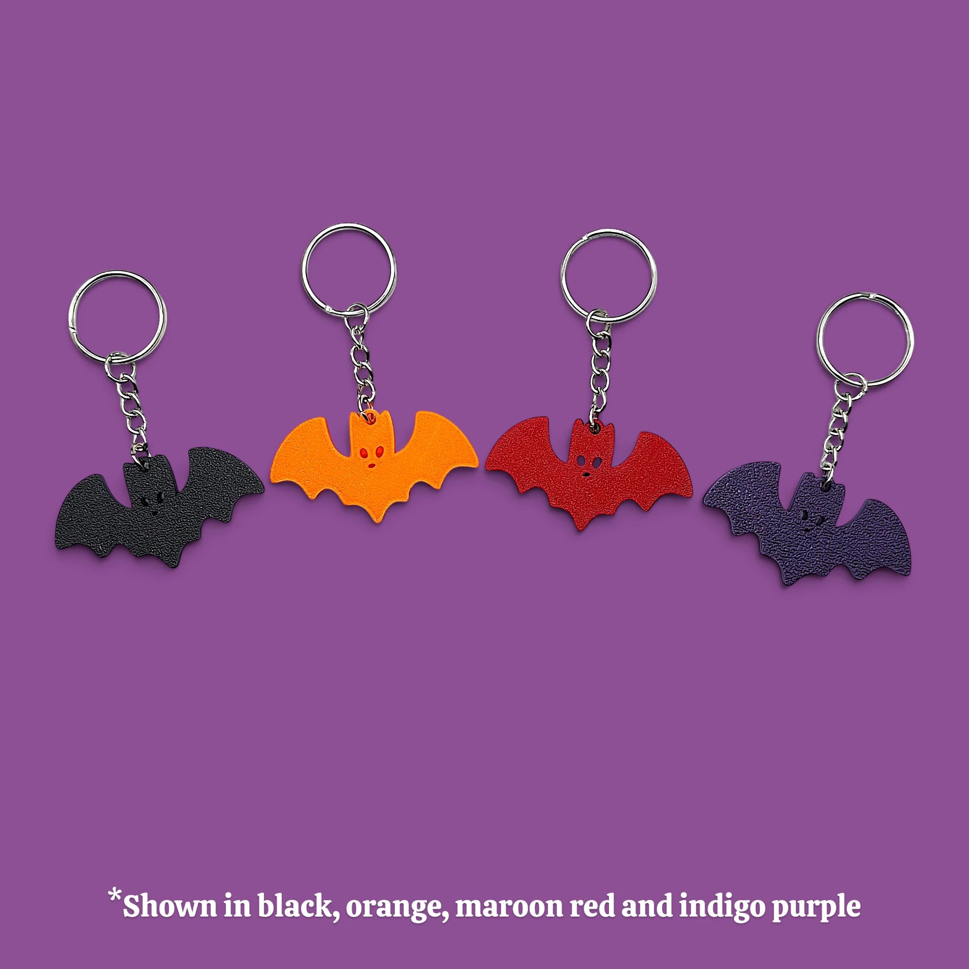 Colorful customizable Halloween bat keychains in silver - eco-friendly spooky charms, perfect for Halloween gifts, party favors, or gothic-themed keyring collections.