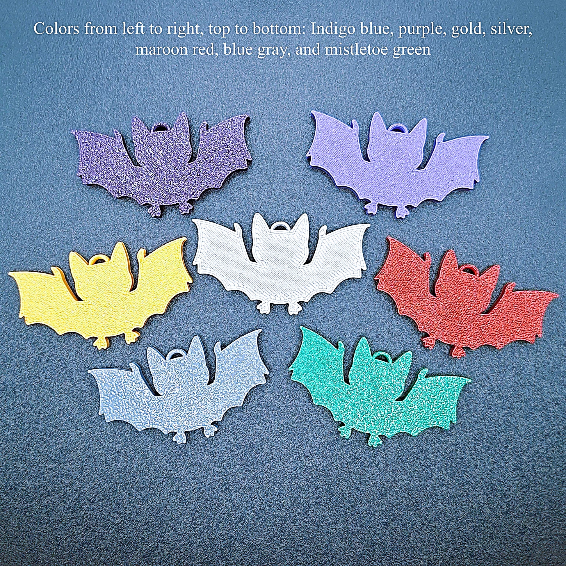 Photo guide of multicolor bat keychains, sustainable Halloween key rings, gothic party favors, and quirky bat-themed accessories.