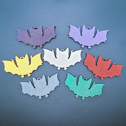 Front view of multicolor bat keychains, sustainable Halloween key rings, gothic party favors, and quirky bat-themed accessories.