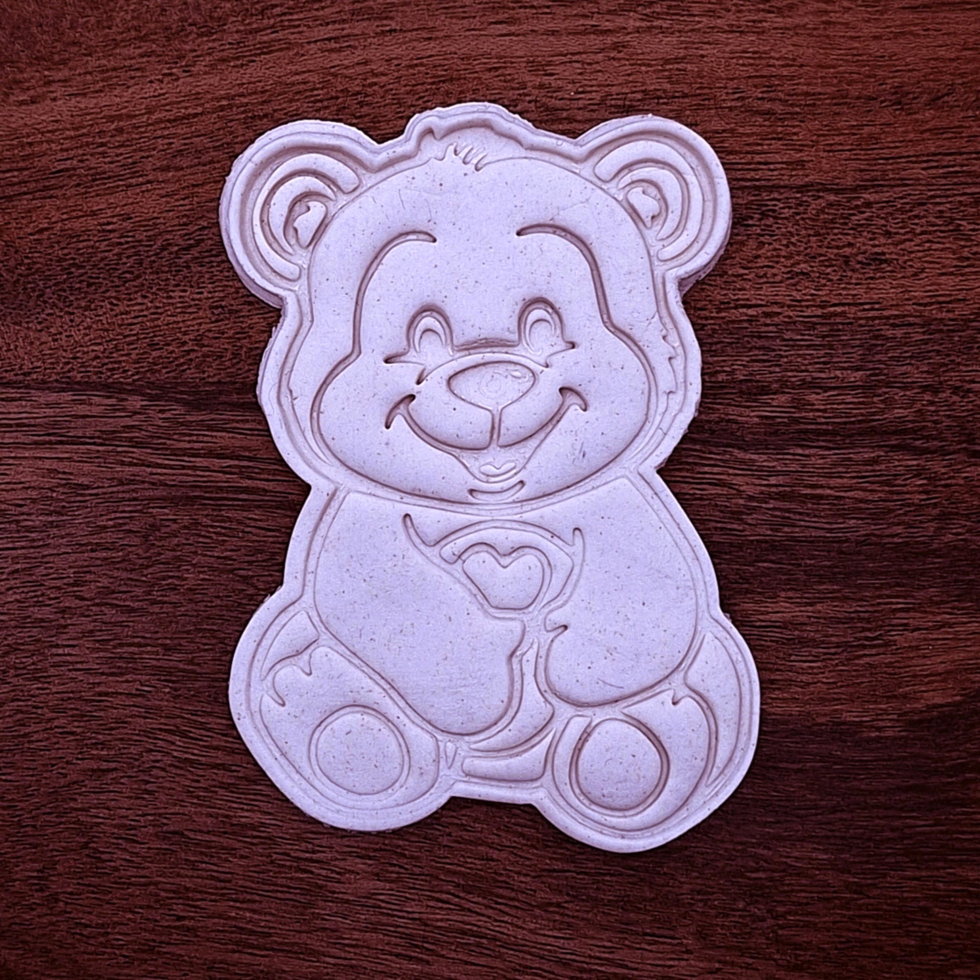Teddy bear holding heart cookie dough imprint with clear stamped details. Perfect for Valentine’s Day, baby showers, or sweet bear-themed treats.