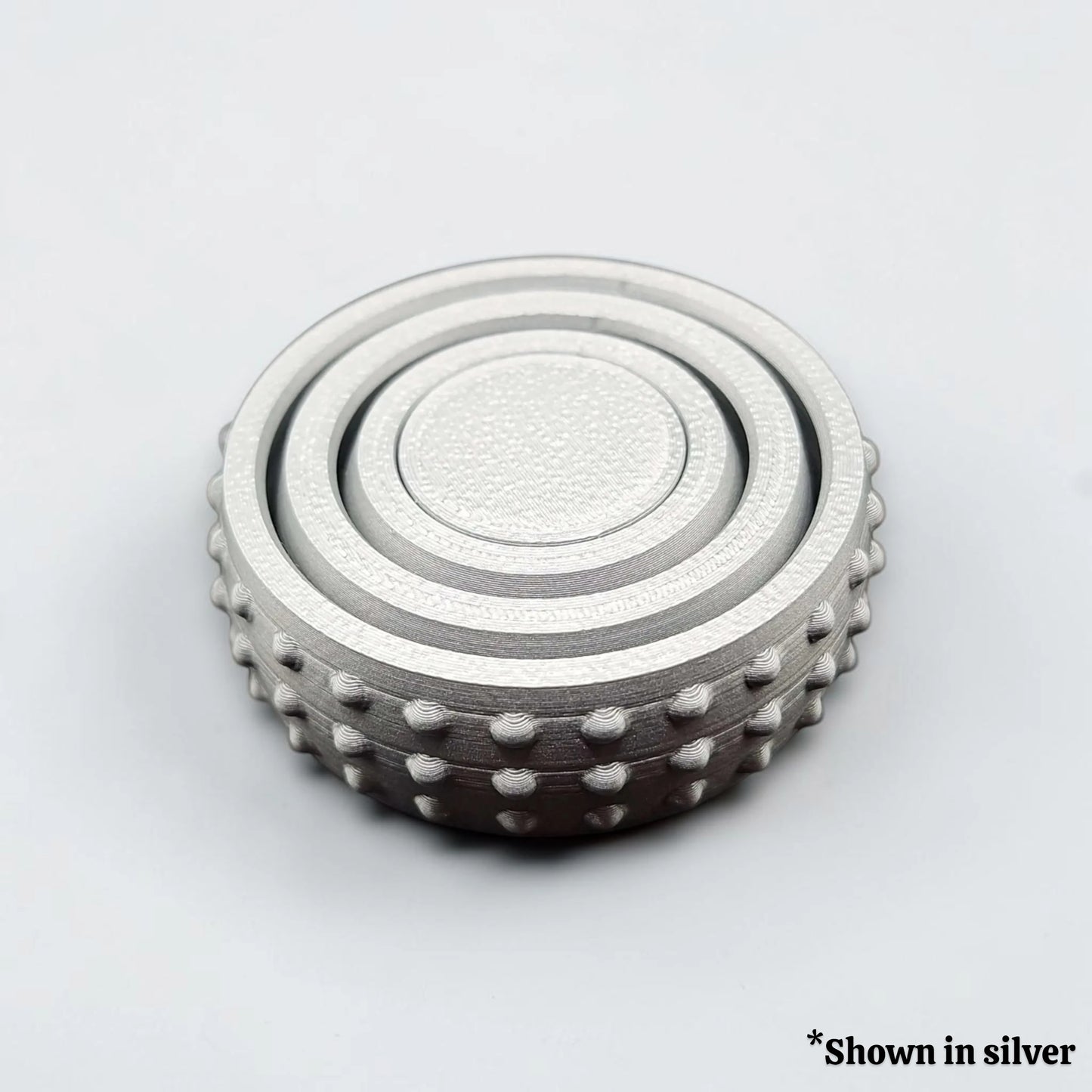 Fidget and gyro spinner in silver, perfect for party favors, event giveaways, classroom prizes and promotional items. Customizable in 30 colors and handmade in USA.