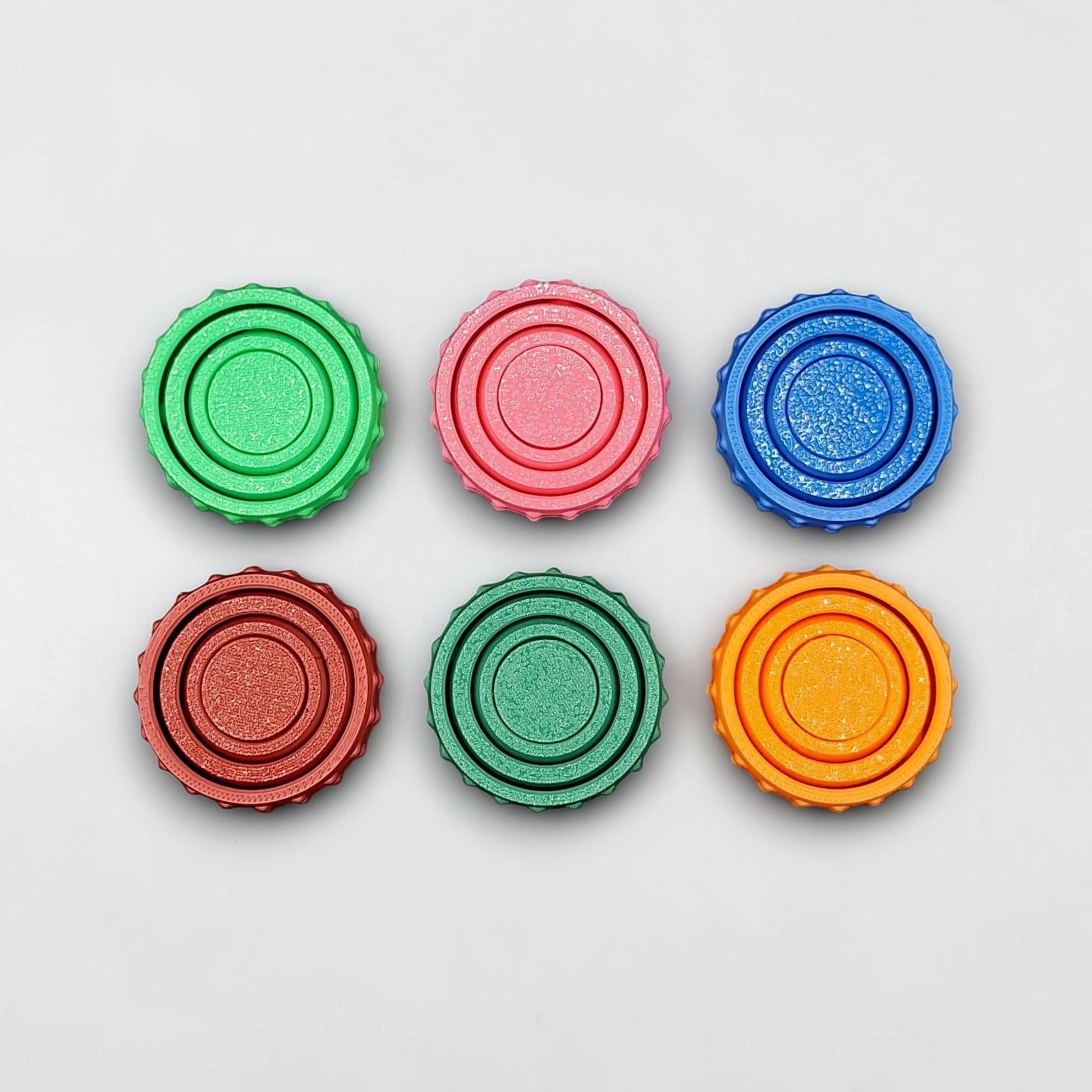Bulk fidget and gyro spinners in various colors, perfect for party favors, event giveaways, classroom prizes and promotional items. Customizable in 30 colors and handmade in USA.
