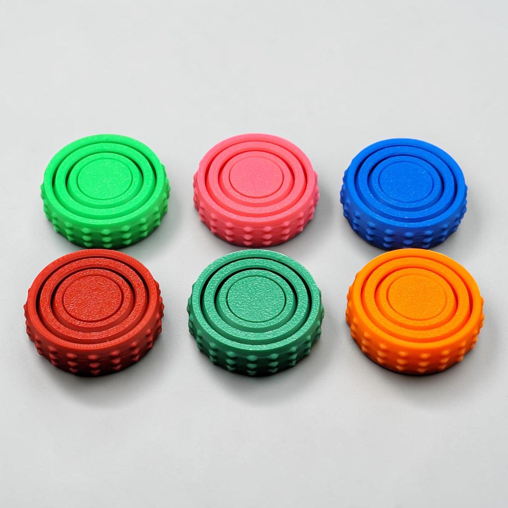 Bulk fidget and gyro spinners in six colors, perfect for party favors, event giveaways, classroom prizes and promotional items. Customizable in 30 colors and handmade in USA.