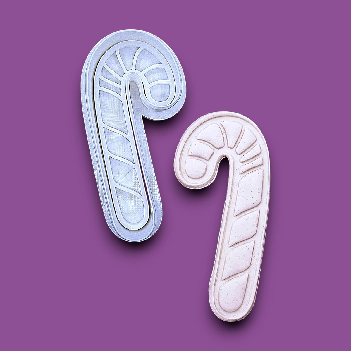 Candy cane cookie cutter and dough cutout and imprint, perfect for Christmas treats, crafts, clay, fondant and biscuits. Handmade in USA and available in 30 unique colors.