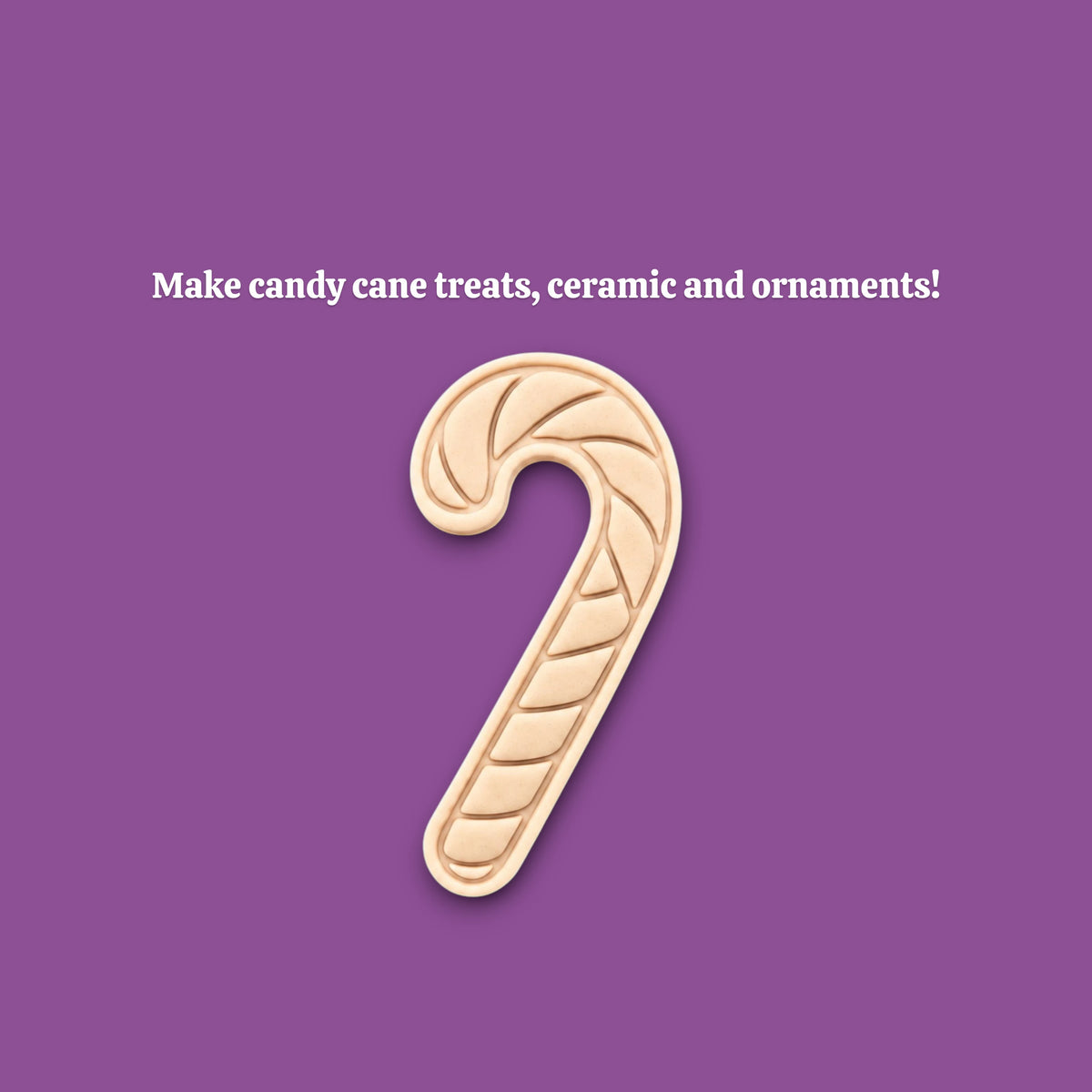 A white candy cane-shaped cookie cutter mold is centered on a solid purple background, with the text 'Make candy cane treats, ceramics and ornaments!' above it.