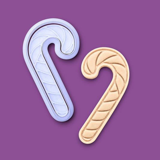 Candy cane cookie cutter and stamp alongside a dough cutout and imprint, perfect for holiday treats, gifting and ceramics.