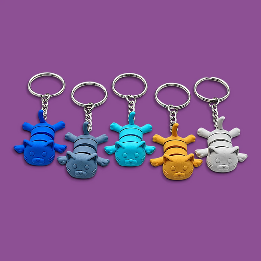 Articulated and jointed cat keychains in assorted colors, perfect for classroom prizes, party favors, event giveaways, vet clinic and shelter gifts, and stocking stuffers. Handmade and customizable in 30 colors.