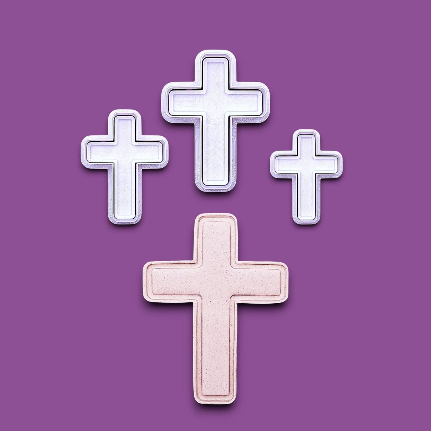 Four cross-shaped cookie cutters with stamps alongside a dough cutout and imprint, perfect for VBS, Easter and holiday treats.