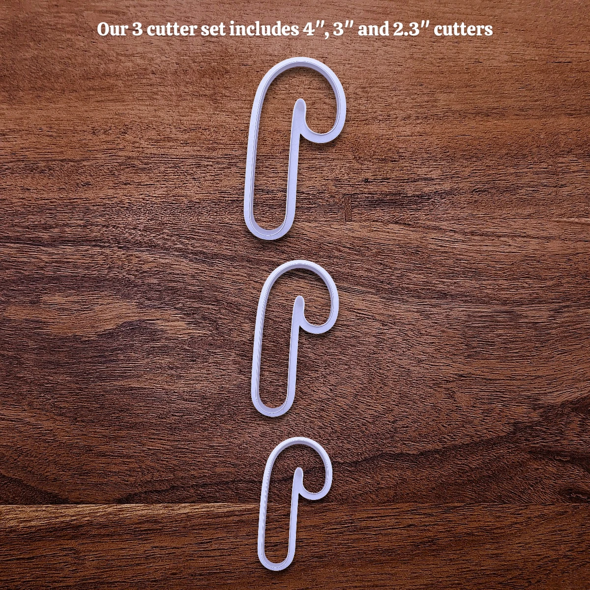 Handmade and customizable Candy Cane Christmas Cookie Cutter in 3 sizes - adds festive striped detail for easy holiday baking and decorating treats, available in 30 unique colors.