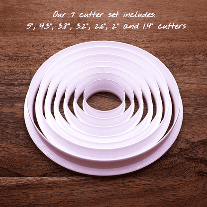 Set of 7 customizable circle cookie cutters from 5" to 1.4". Perfect for baking, fondant, biscuits, sandwiches, and crafting round shapes.