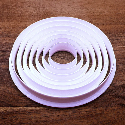 Set of 7 customizable circle cookie cutters from 5" to 1.4". Perfect for baking, fondant, biscuits, sandwiches, and crafting round shapes.