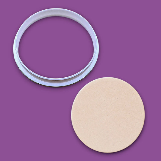 Circle cookie cutter alongside a dough cutout, perfect for baking, fondant, biscuits, sandwiches, and crafting round shapes.