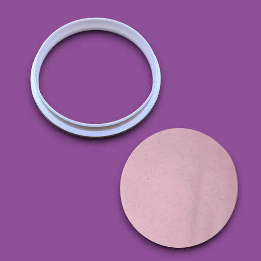 Round circle cookie cutter for baking, fondant, and crafts beside a circle dough cutout. Handmade circular tool available in multiple sizes for perfect shapes