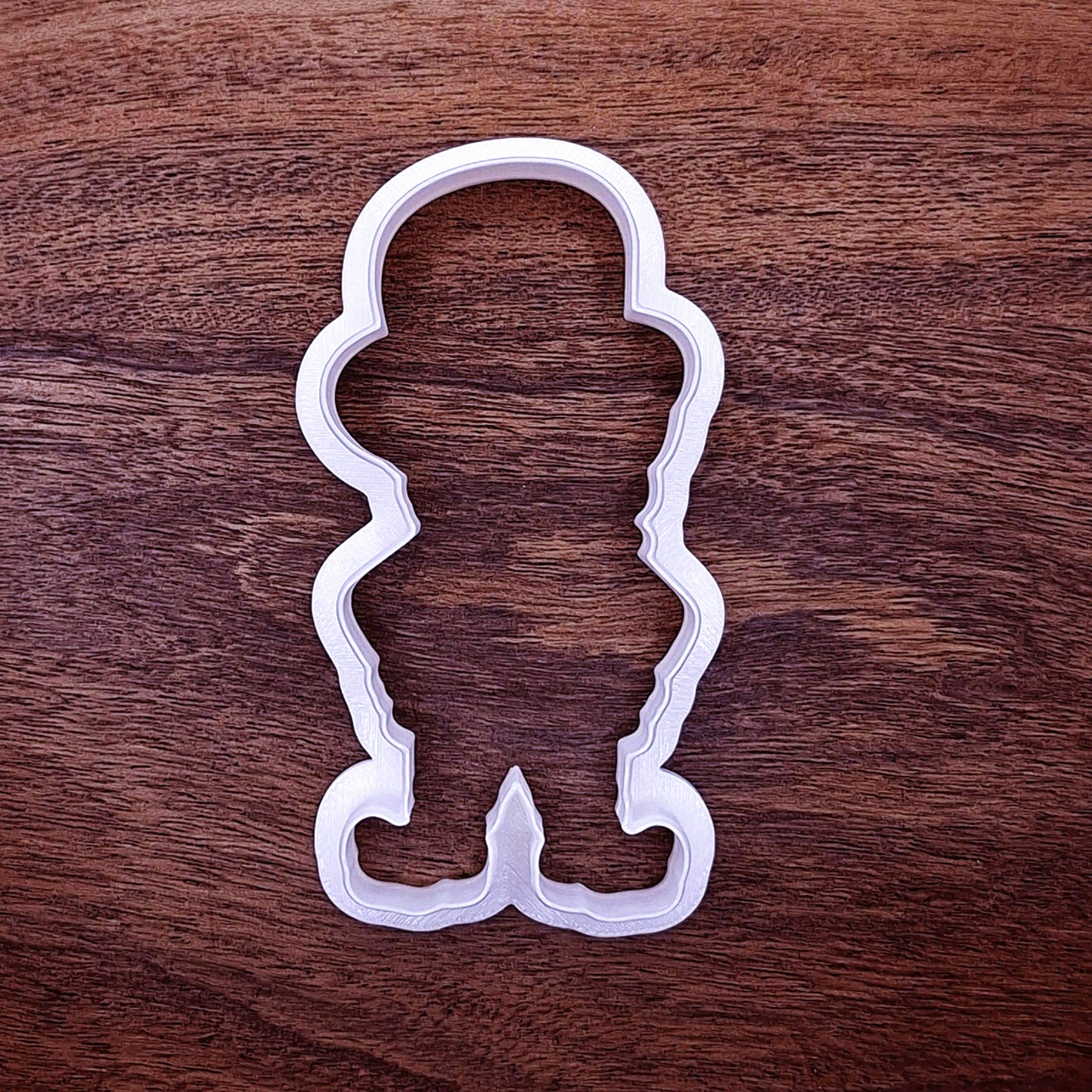 Leprechaun-shaped cutter with smooth edge. Ideal for festive cookie decorating or clay shaping.