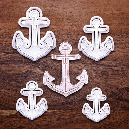 View of multiple anchor cookie cutters with matching stamps. Ideal for making detailed cookies, fondant toppers, or ocean party treats.