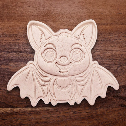 Stamped cute bat cookie dough with cute details from cutter and stamp set—perfect for cute and spooky Halloween bakes without the need for piping.