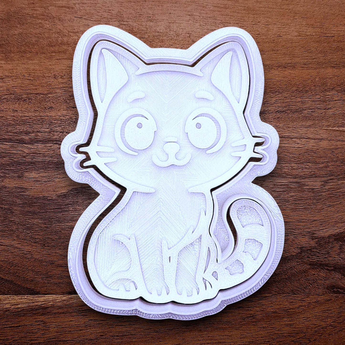 Customizable cat cookie cutter and stamp, perfect for kitty cookie designs, fondant toppers, birthday parties, crafts or cat themed baking projects.