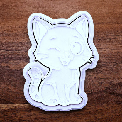 Winking cat cookie cutter and stamp, great for creating detailed, cat-themed cookies, fondant pieces, or party treats for birthdays, parties and craft projects.