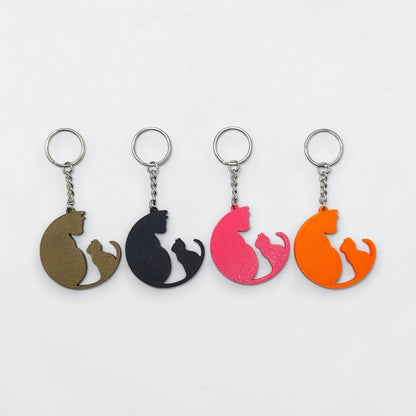 Cat mom and kitten keychain shown in assorted colors, perfect for gifting to cat moms and dads, stocking stuffers, animal shelters, rescues and vet clinics.