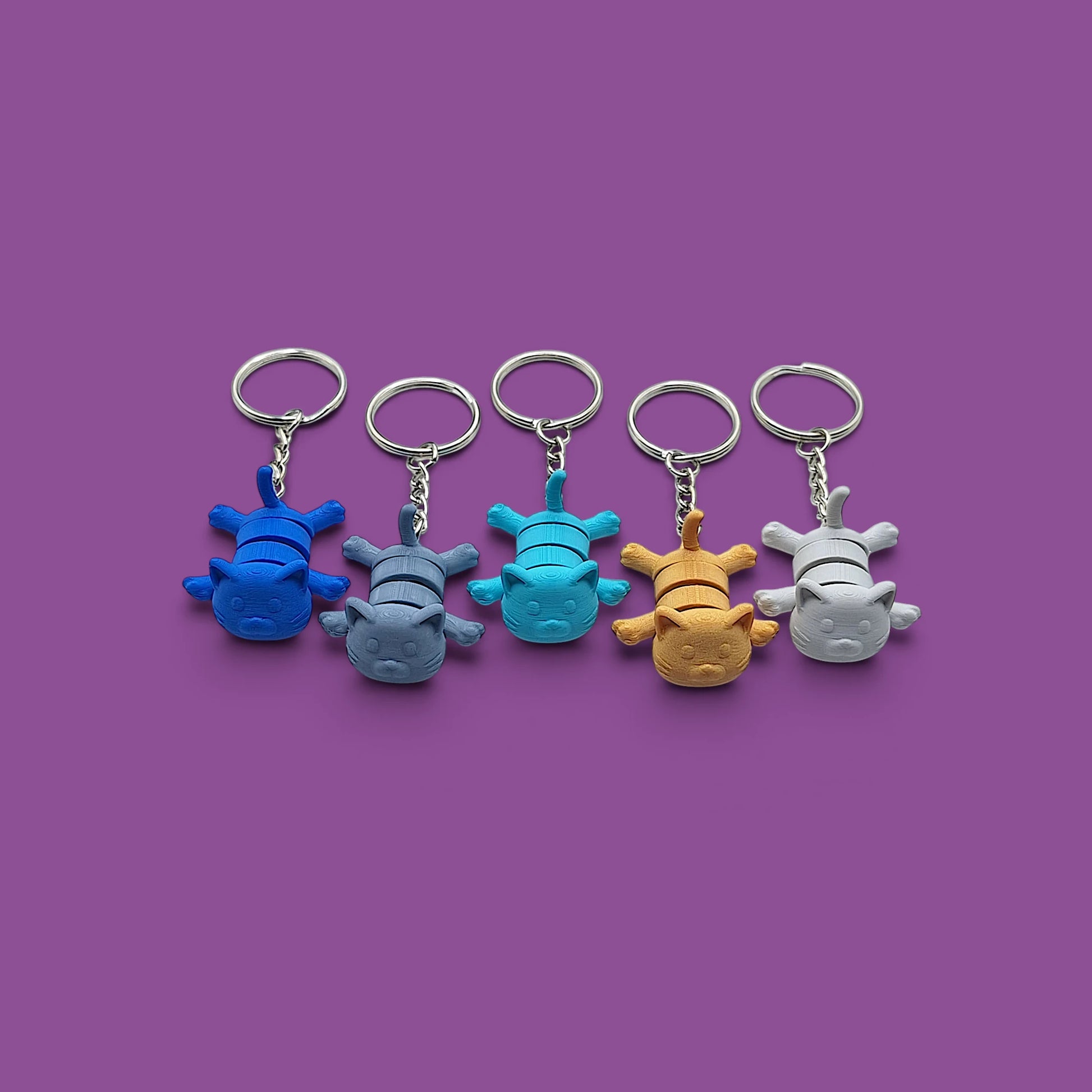 Cat keychains in assorted colors , customizable and handmade, perfect for classroom prizes, party favors and event giveaways.